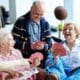 Is Aged Care In Demand In Australia - Group Of Seniors Playing Cards